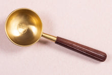 Gold brass tadka spoon with wooden handle 