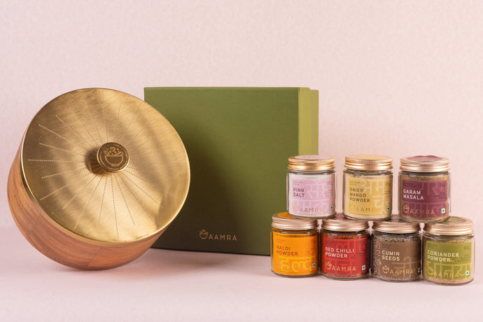 Set of spice jars with a wooden spice box